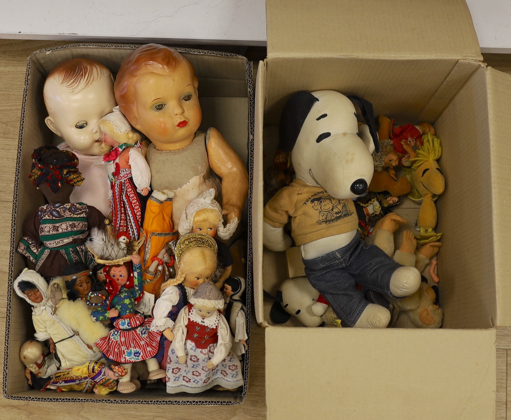 An assortment of soft toys, including Steiff and two dolls